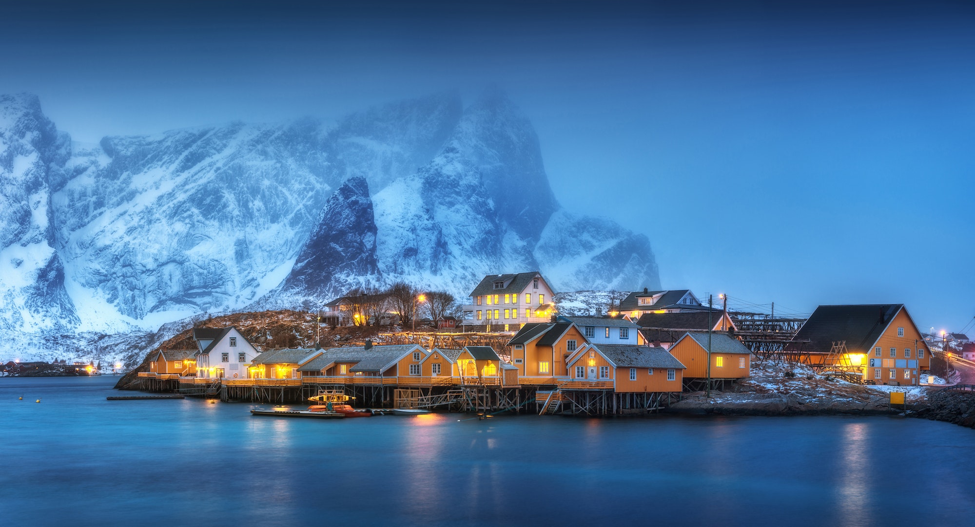 Beautiful yellow rorbuer and houses in Norway